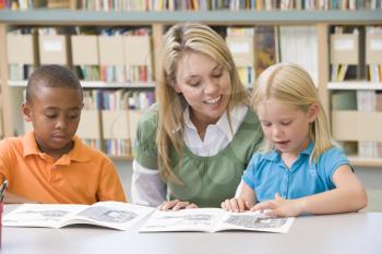 Royalty Free Photo of Two Students With a Teacher