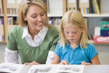 Royalty Free Photo of a Student Reading in Class