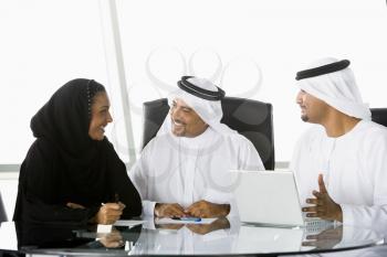 Royalty Free Photo of Three People at an Office Desk