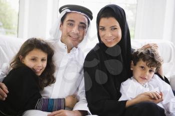 Royalty Free Photo of a Family Sitting on the Couch