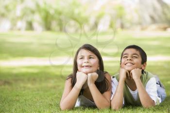 Royalty Free Photo of Two Children Lying on the Grass