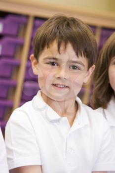 Royalty Free Photo of a Boy in a Classroom