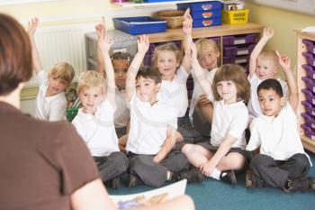 Royalty Free Photo of Students With Their Hands Raised