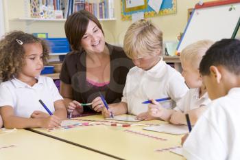 Royalty Free Photo of a Teacher and Students Counting Beads