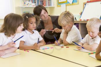 Royalty Free Photo of Students and a Teacher in Class