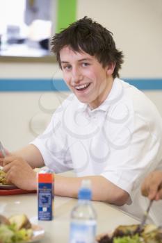 Royalty Free Clipart Image of a Student in a Cafeteria