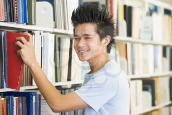 Royalty Free Photo of a Guy in a Library