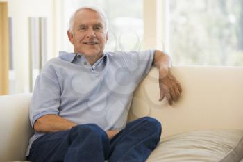 Royalty Free Photo of a Man on a Couch