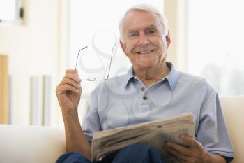 Royalty Free Photo of a Man Reading a Newspaper