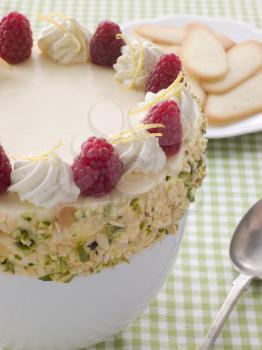 Royalty Free Photo of Bowl of Chilled Lemon Souffle With Biscuits