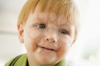 Royalty Free Photo of a Baby With Food on His Face