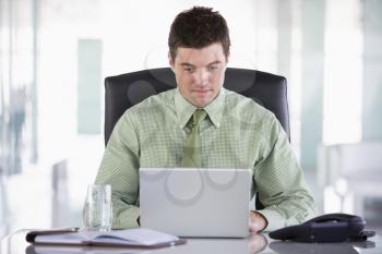 Royalty Free Photo of a Man With a Laptop