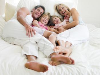 Royalty Free Photo of a Family in Bed