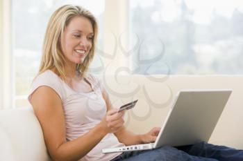 Royalty Free Photo of a Woman With a Laptop and a Credit Card