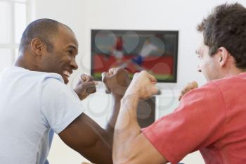 Royalty Free Photo of Two Men Watching Soccer