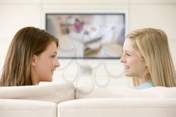 Royalty Free Photo of Two Women Watching Television