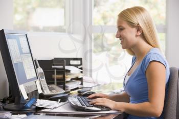 Royalty Free Photo of a Woman at Home on the Computer