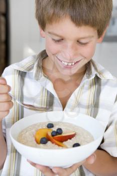 Royalty Free Photo of a Boy Eating Cereal