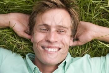 Royalty Free Photo of a Guy Lying on the Grass