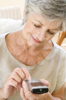 Royalty Free Photo of a Woman Sending a Text Message