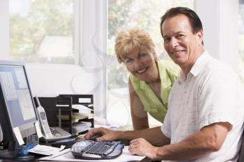 Royalty Free Photo of a Couple at a Computer