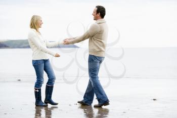 Royalty Free Photo of a Couple Walking on the Beach