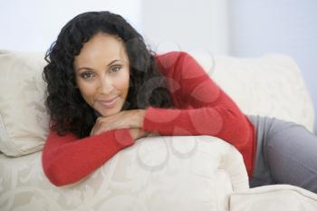 Royalty Free Photo of a Woman on a Couch