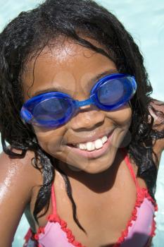Royalty Free Photo of a Girl Wearing Goggles at a Pool
