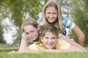 Royalty Free Photo of Girls Lying on the Grass