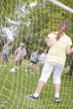 Royalty Free Photo of a Friends Playing Soccer