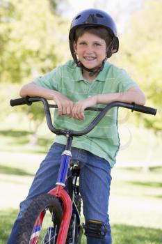 Royalty Free Photo of a Boy on a Bike