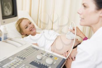 Royalty Free Photo of a Woman Getting an Ultrasound