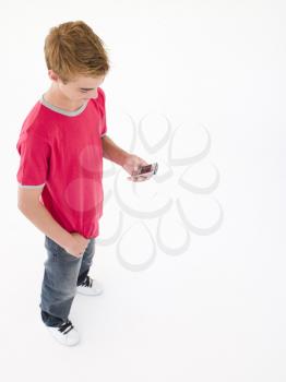 Royalty Free Photo of a Boy With a Cellphone