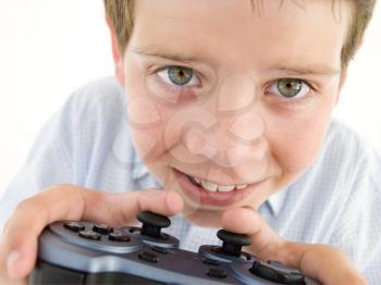 Royalty Free Photo of a Boy Playing a Video Game