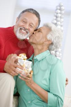 Royalty Free Photo of a Couple Holding a Gift