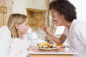 Royalty Free Photo of a Nurse With a Young Patient