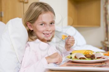 Royalty Free Photo of a Girl Eating in a Hospital