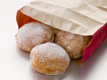 Royalty Free Photo of a Bag of Raspberry Doughnuts