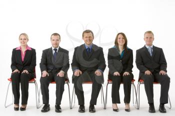 Royalty Free Photo of a Group of People in Chairs