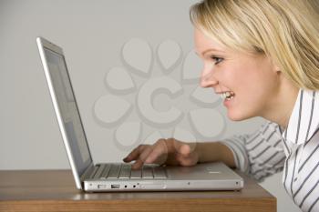 Royalty Free Photo of a Woman With a Laptop