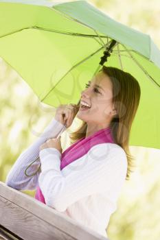 Royalty Free Photo of a Girl With an Umbrella