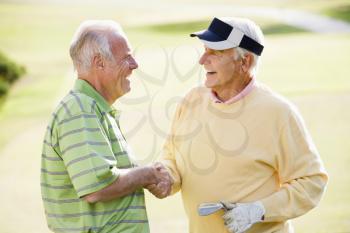 Royalty Free Photo of Two Men Golfing