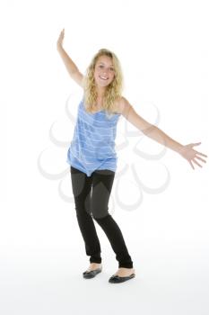 Royalty Free Photo of a Girl With Her Arms Outstretched