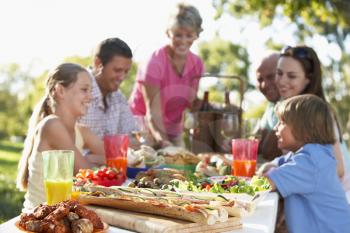 Royalty Free Photo of a Family Dining Outside