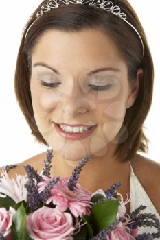 Royalty Free Photo of a Bride Holding Flowers