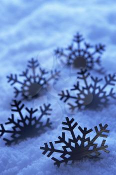 Royalty Free Photo of Decorative Snowflakes in Snow