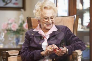 Royalty Free Photo of a Woman Sending a Text Message