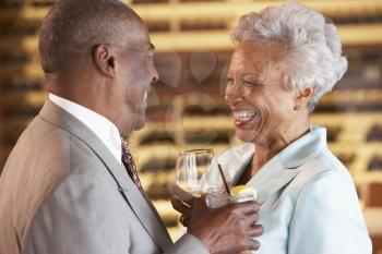 Royalty Free Photo of a Couple Having a Drink at a Bar