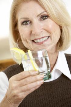 Royalty Free Photo of a Woman Having a Drink