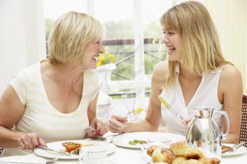 Royalty Free Photo of Two Women Having Breakfast in a Hotel